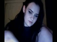 Brunette skinny teen babe in little panties and a black top entertaining strangers on webcam